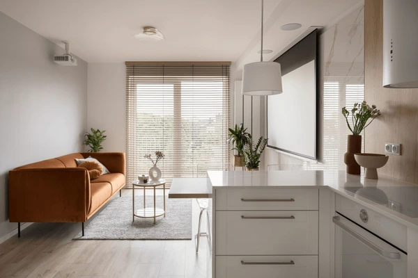 A stylish apartment featuring wooden blinds that offer warmth and privacy, enhancing the overall décor—best blinds & curtains Dubai 2025.