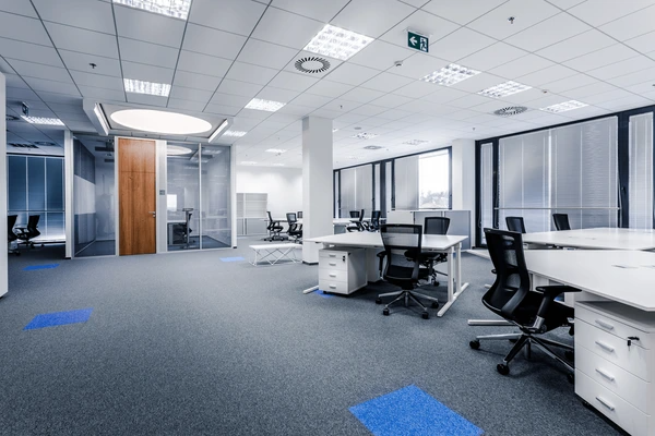A sleek and modern open-plan office with high-quality window blinds, offering a professional and well-lit workspace.