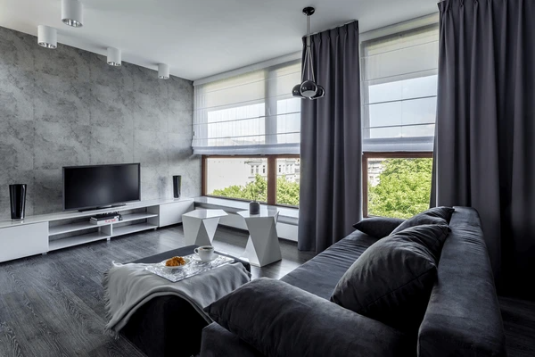 Contemporary living room featuring elegant window blinds and curtains, highlighting the best blinds in Dubai for 2025.