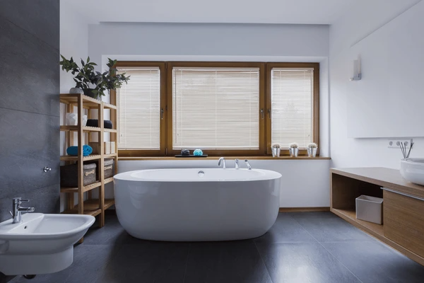Stylish wooden Venetian blinds in a modern Dubai bathroom, offering privacy, elegance, and natural light control for 2025 home décor trends.