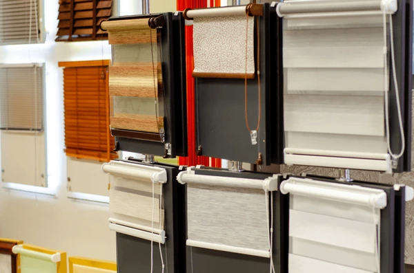 A variety of high-quality Roman blinds displayed in a legit Emirati shop in Dubai, featuring different designs, textures, and materials.