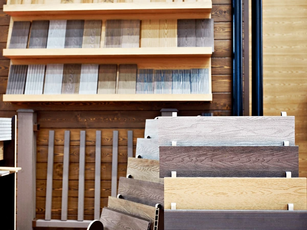 Display of wooden-style blinds and decorative panel samples in a trendy Dubai store offering budget-friendly luxury home solutions.