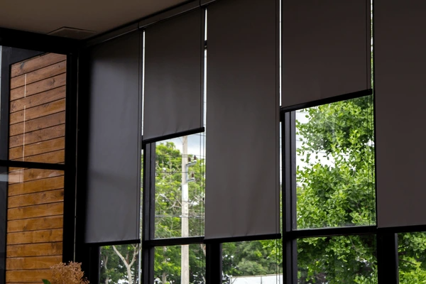 Best Long Blinds in Dubai 2025 - Sleek black roller blinds covering large windows, blending luxury with modern design.