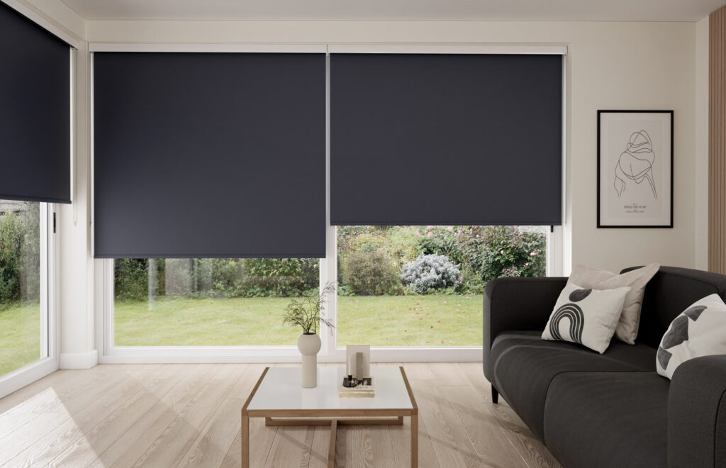 Cozy living room with large patio doors featuring dark grey roller blinds and modern minimalist decor.