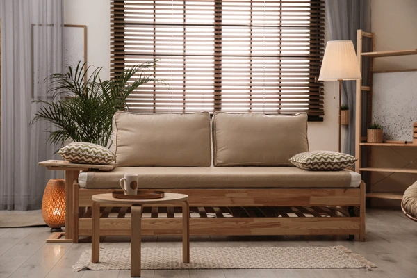 Sleek and elegant recycled blinds in a cozy Dubai living room with beige furnishings and warm lighting for a sustainable home.