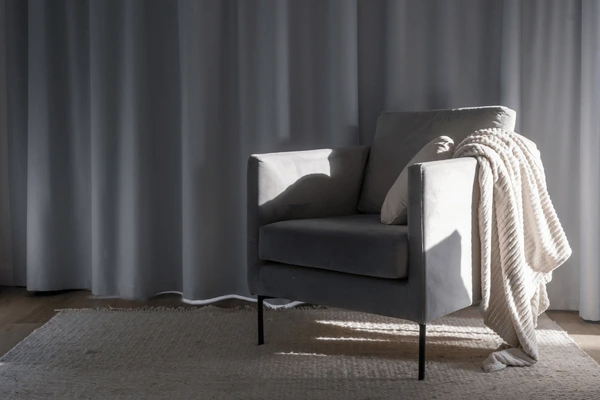 Modern living room with heat-insulation curtains, creating a sleek and cozy atmosphere.