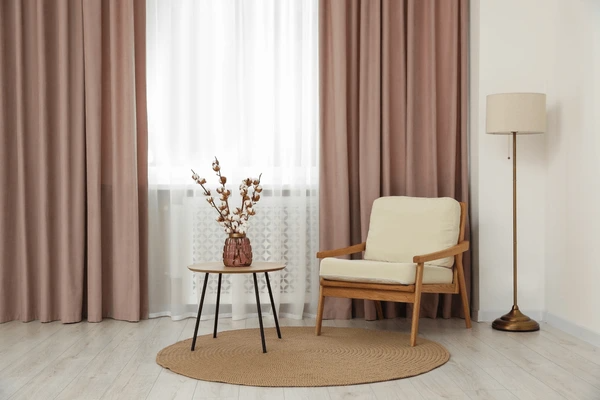 Cozy corner with heat-resistant curtains, creating a warm and inviting atmosphere.