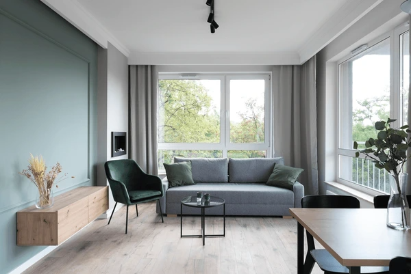 Contemporary living room with heat-resistant curtains that offer both style and superior insulation.