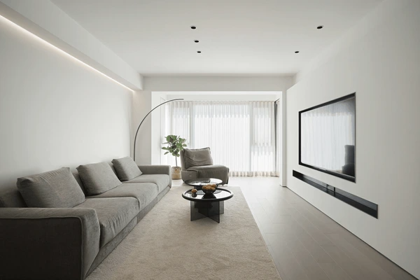 Stylish unwrinkled sheer curtains in a bright, minimalist living room with neutral décor and contemporary furnishings.