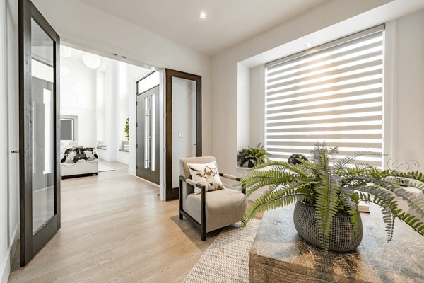 A contemporary living space with sleek zebra blinds, elegant furniture, and natural lighting, showcasing Dubai’s top-rated 2025 blind design.