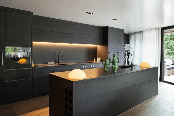 Best Washable & Shrink-Proof Curtains in Dubai 2025 complementing a modern, sleek kitchen with black furniture and contemporary design elements.