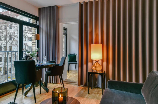 A cozy, stylish living room with wave curtains adding a sleek, modern touch, ideal for enhancing Dubai homes in 2025.
