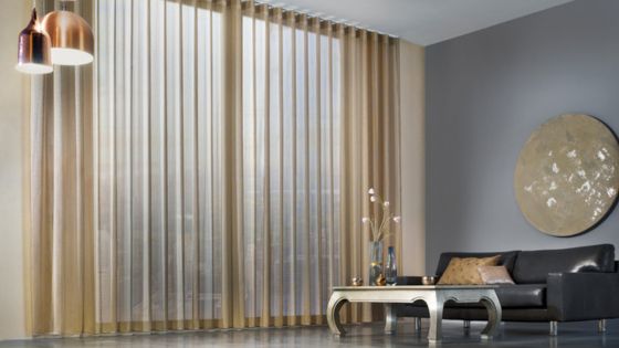 Elegant wave curtains in a modern high-rise apartment, creating a sleek and stylish atmosphere with soft lighting and contemporary decor.