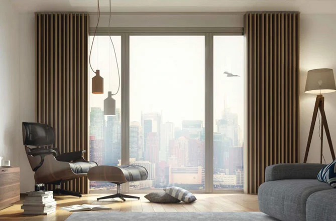 A sleek living room with top-rated wave curtains framing a stunning city view, perfect for creating a modern, cozy ambiance in Dubai homes.