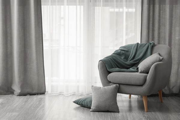 Stylish living space featuring heat-resistant curtains that blend modern elegance with practical insulation.