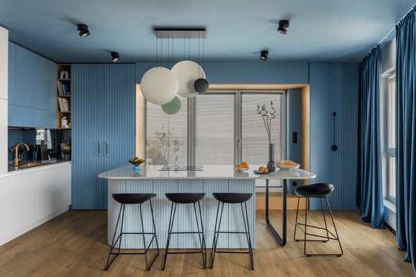Best Washable & Shrink-Proof Curtains in Dubai 2025 complementing a trendy modern kitchen with blue accents, sleek design, and a minimalist style.