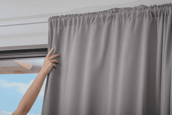Closed black blackout curtains blocking all light, creating a private, cozy, and elegant ambiance ideal for modern Dubai homes in 2025.