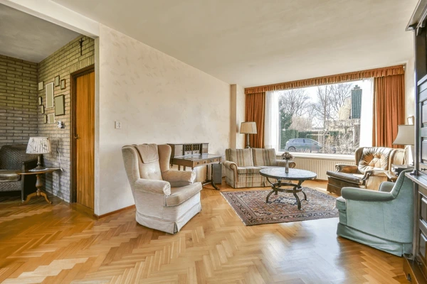 Classic vintage-style living room in Dubai with elegant brown curtains, antique furniture, and warm wooden flooring reflecting the 2025 stylish curtain trend.